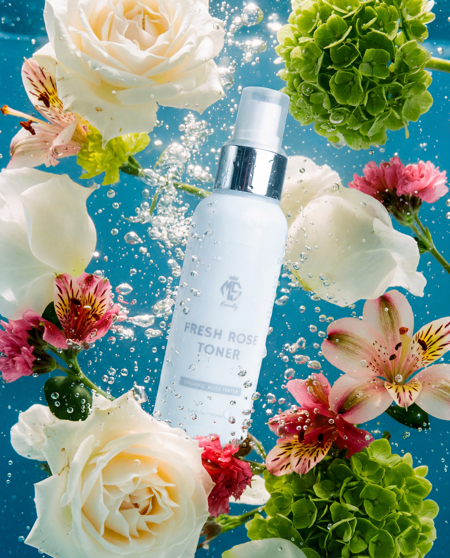 Skincare bottle labeled 'Fresh Rose Toner' surrounded by floating flowers on a blue background